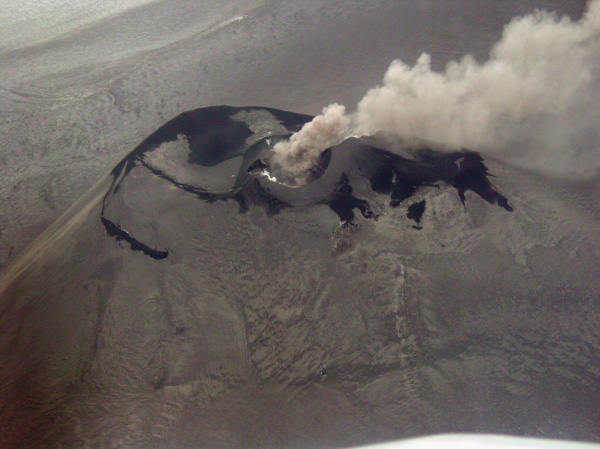 Veniaminof intracaldera cinder cone. Ash plume drifting to NE. Photo taken from a Navajo (Security Aviation) during an observational overflight. Elevation of cone is 7075 ft.